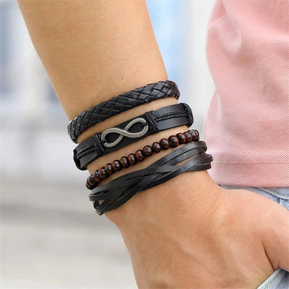 Bracciale in pelle e lega di zinco. Set 4 pezzi, misura regolabile da 26 a 31 cm.